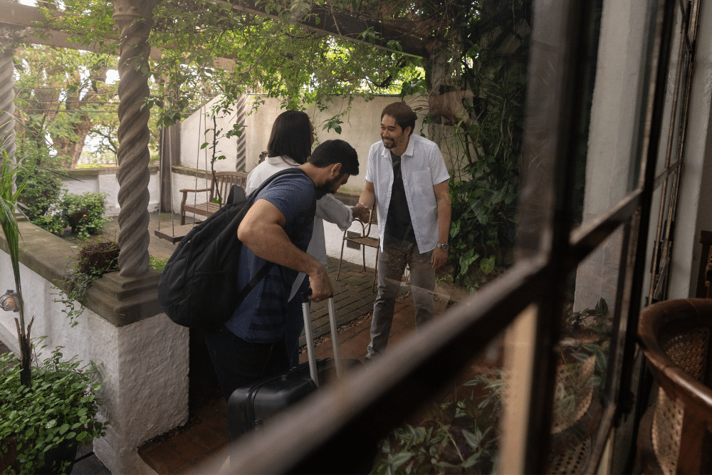 Vacation rental host greeting guests