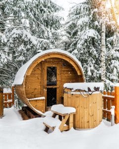Outdoor sauna surrounded by snow