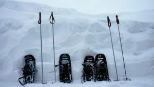Snowshoes propped up against snow