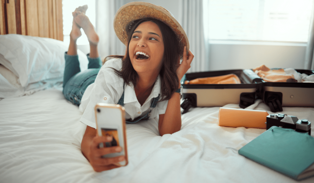 Woman laughing at phone