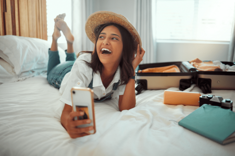 Woman laughing at phone