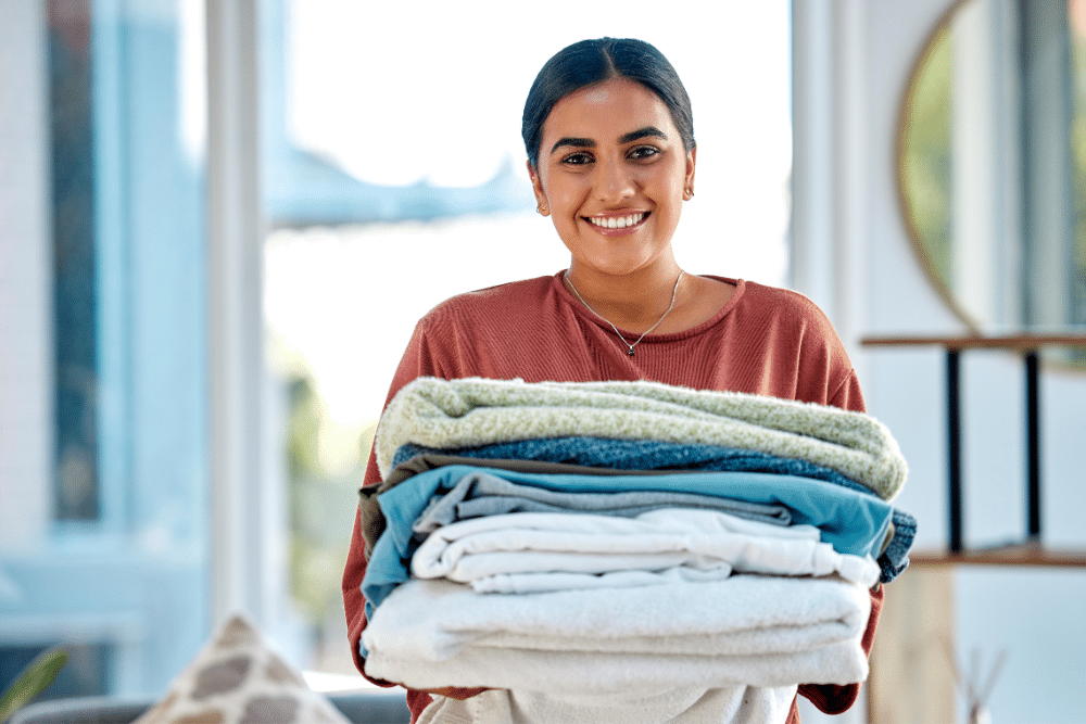 Woman carrying towels